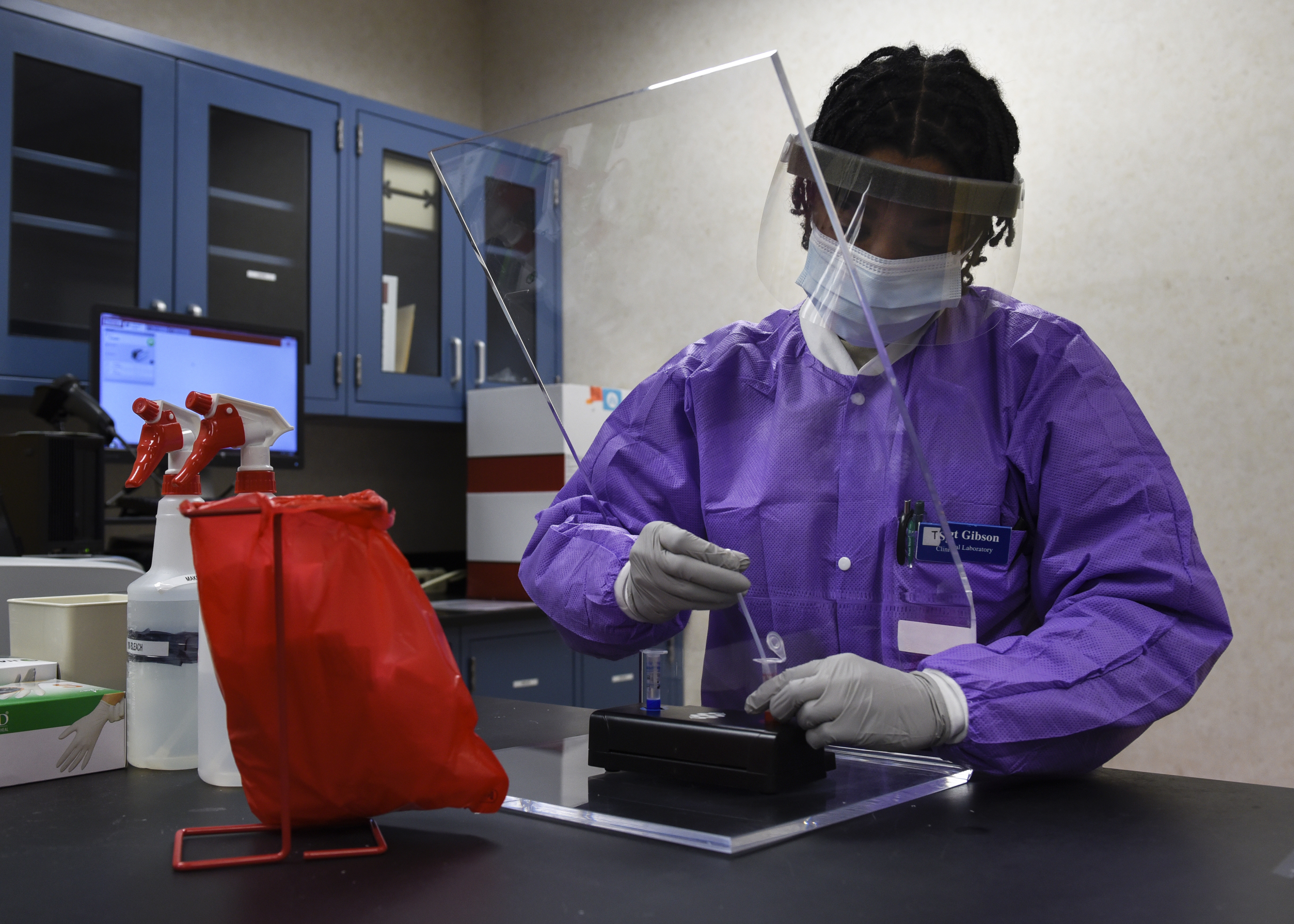 Female Airman handling chemicals